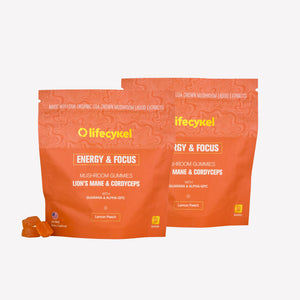 Two orange packages of lifecykel Energy & Focus mushroom gummies on a white background