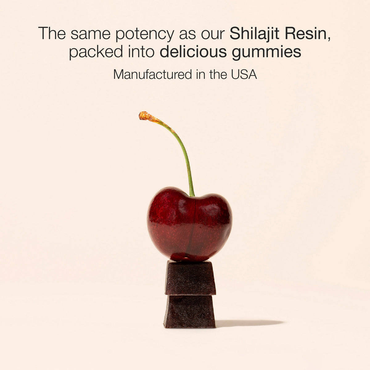Cherry with a small stack of dark gummies on a beige background, text about Shilajit Resin gummies.