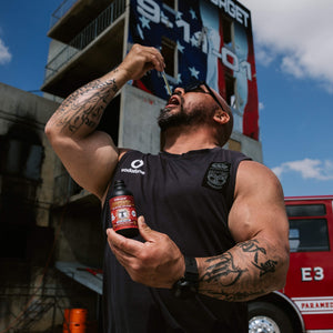 Man pouring dropper liquid of Lifecykel Cordyceps mushroom extracts supplements ln his mouth