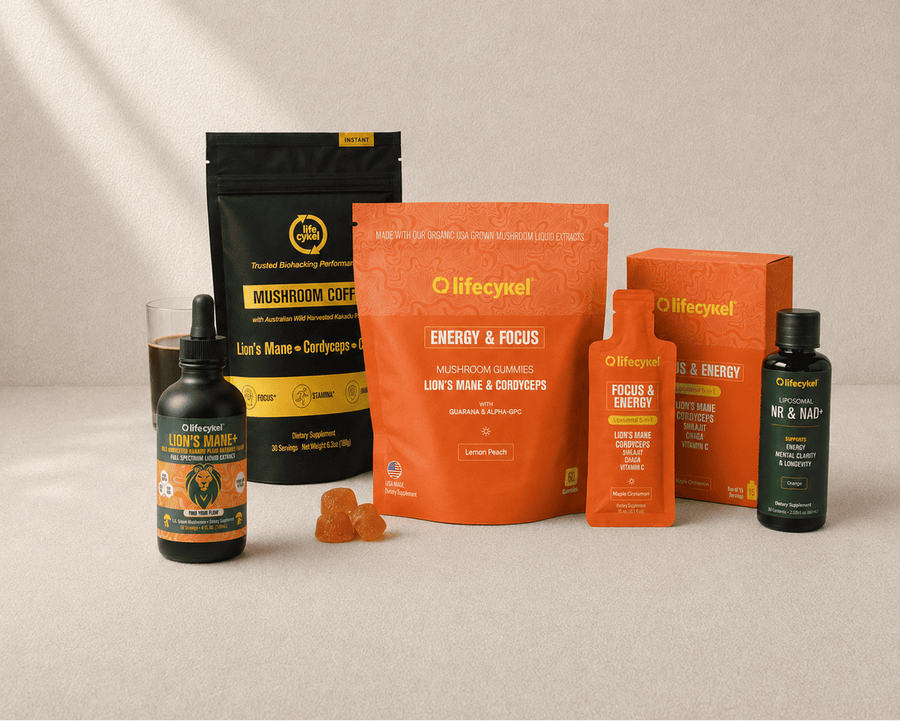 A set of lifecykel wellness products arranged on a light beige surface with soft diagonal shadows. 