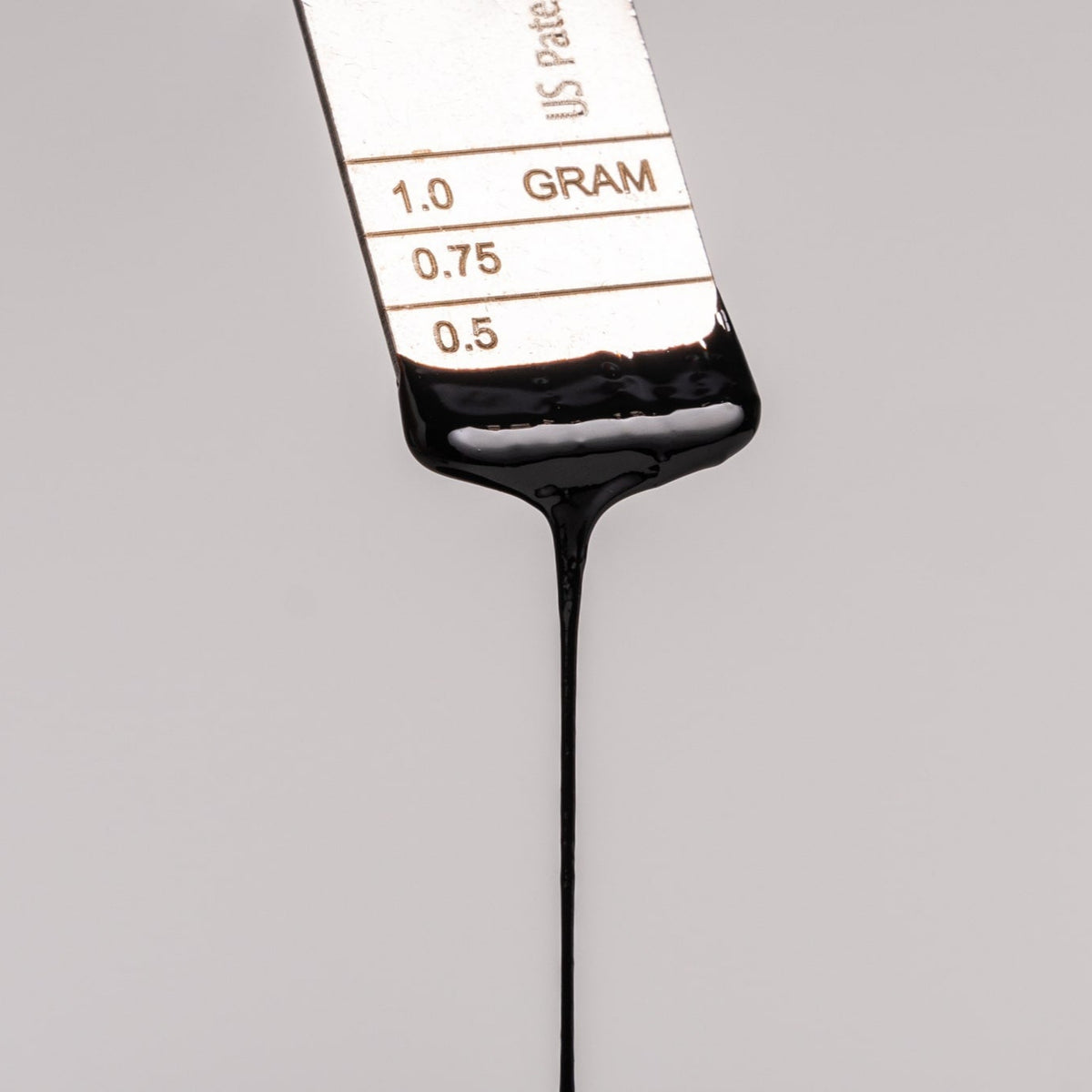 Lifecykel Shilajit liquid syrup dropping from dosage measurement